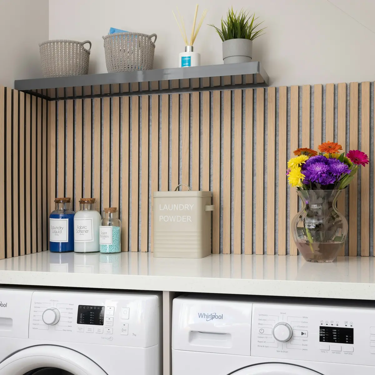 Laundry counter with open shelving above front-load machines